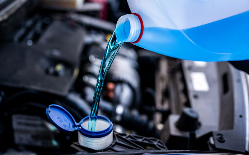 Coolant being poured -Summer Car Service Tips for Old Saybrook, CT Drivers